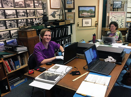 UBC Okanagan students Eamon Riordan-Short and Sharon Hanna scan in materials at the Peachland Museum in spring 2017.