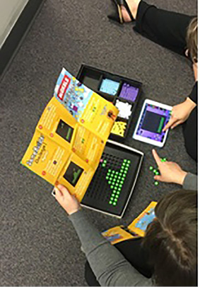 Figure 2. Exploring video game making kit called Bloxels. Photo credit: Kate Shively