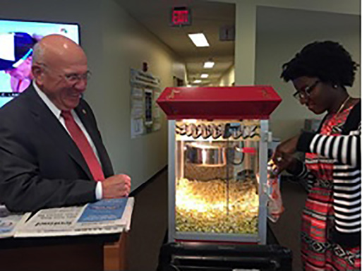 The Associate Dean for Faculty and Academic Affairs waiting in line during Popcorn Day.