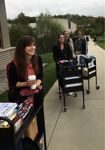 Library staff transport course reserves and other materials from the Thun Library to another location on campus.