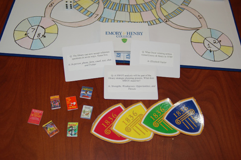 Question cards and game pieces. Photo by Adam Alley.