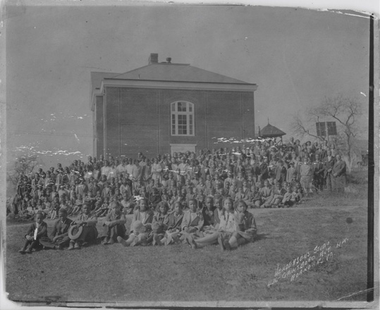 Christiansburg Institute students and faculty pose beside the Edgar A. Long Building. Photo courtesy of Christiansburg Institute Museum and Archives