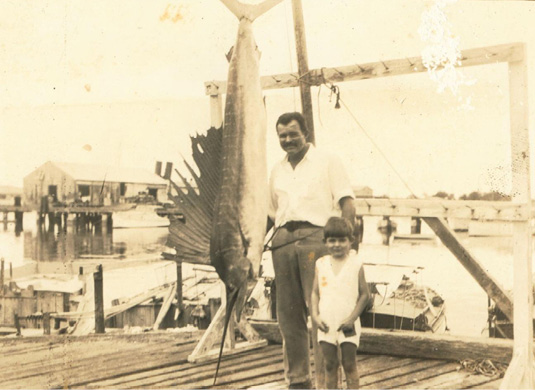 Ernest Hemingway and his middle son, Patrick, posed with a record 119-1/2 pound Atlantic sailfish caught off Key West, Fla., in May 1934