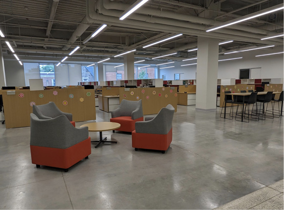 The main staff area features casual alternate seating and gathering spaces.