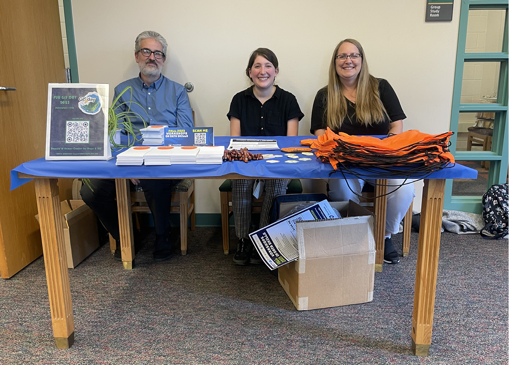 The PSU Libraries Department of Research Informatics and Publishing folks prepare to greet students and postdocs during the STEM-H Graduate Student & Postdoc Mixer in September 2023.
