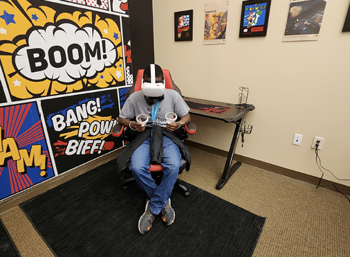 Student using equipment in the AUC Woodruff Library VR Lounge. Photograph by Patrice Williams.